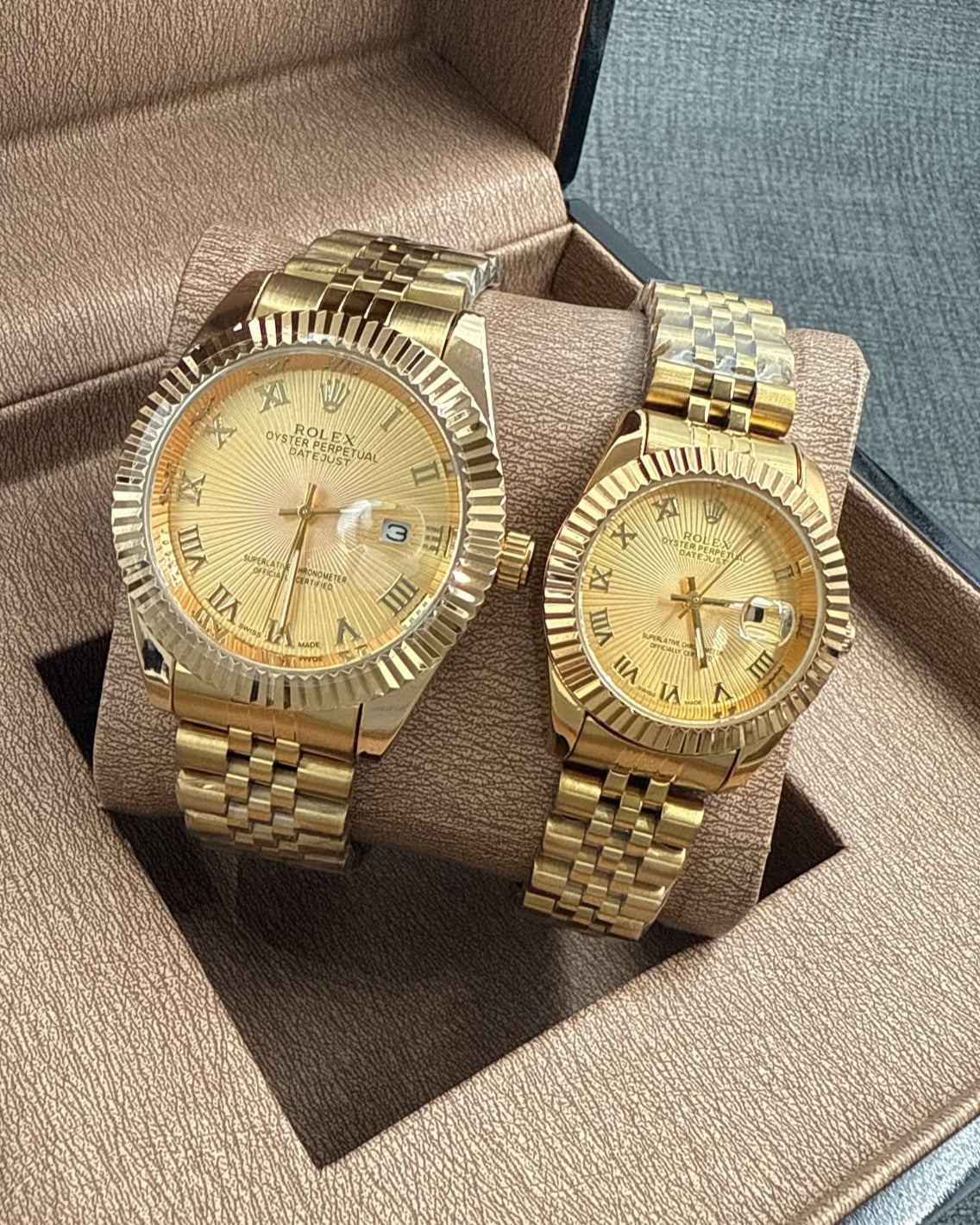Rolex Oyster Perpetual Datejust Couple Watch Set — Matching Gold-Tone Finish with Fluted Bezels & Roman Numeral Dials