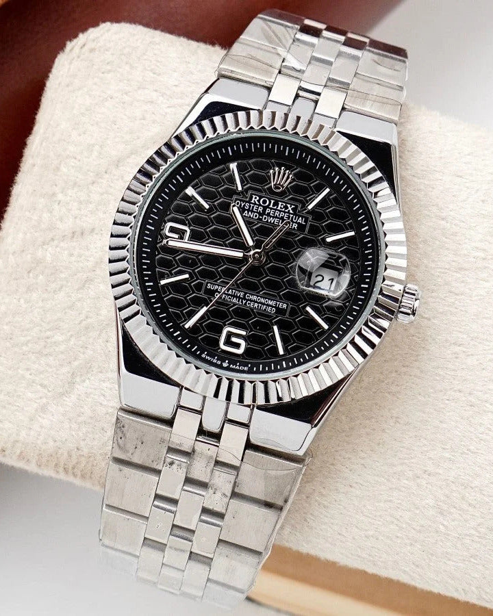 Rolex Land-Dweller Watch — Black Patterned Dial with Arabic Numerals and Fluted Bezel