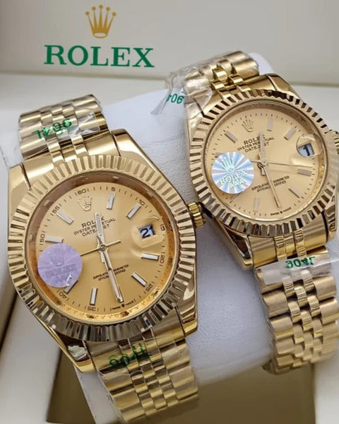 Rolex Oyster Perpetual Datejust Couple Watch Set — Matching Gold-Tone Finish with Fluted Bezels & Roman Numeral Dials