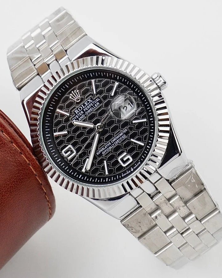 Rolex Land-Dweller Watch — Black Patterned Dial with Arabic Numerals and Fluted Bezel