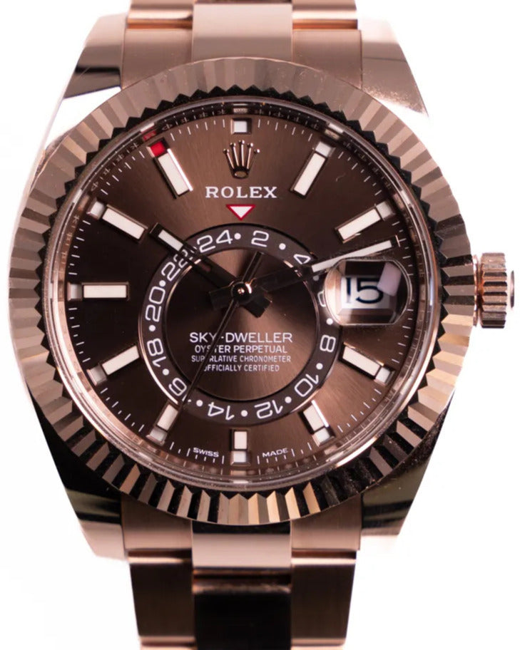 Rolex Sky-Dweller Watch — Brown Dial with Prominent Fluted Bezel & Off-Center 24-Hour Ring